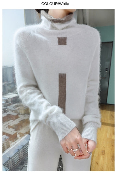 Person wearing a light gray sweater with a cityscape background