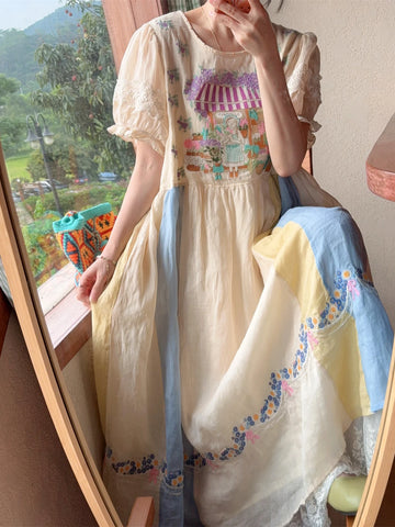 Person wearing a pastel-colored dress with floral patterns in a room with a window view.