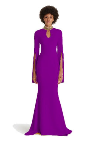 Woman wearing a purple evening gown with long sleeves on a white background