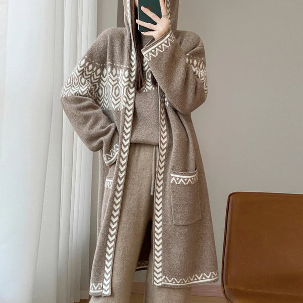 Brown robe with white patterns worn by a person, sitting on a chair.