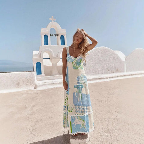 Woman in a colorful dress standing in front of a white church with blue accents on a sunny day.