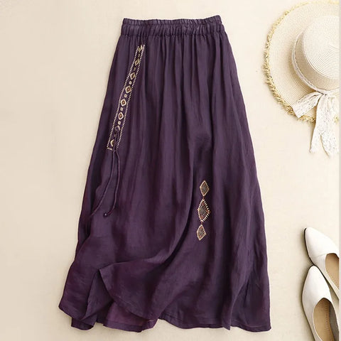 Purple skirt with decorative patterns on a beige background